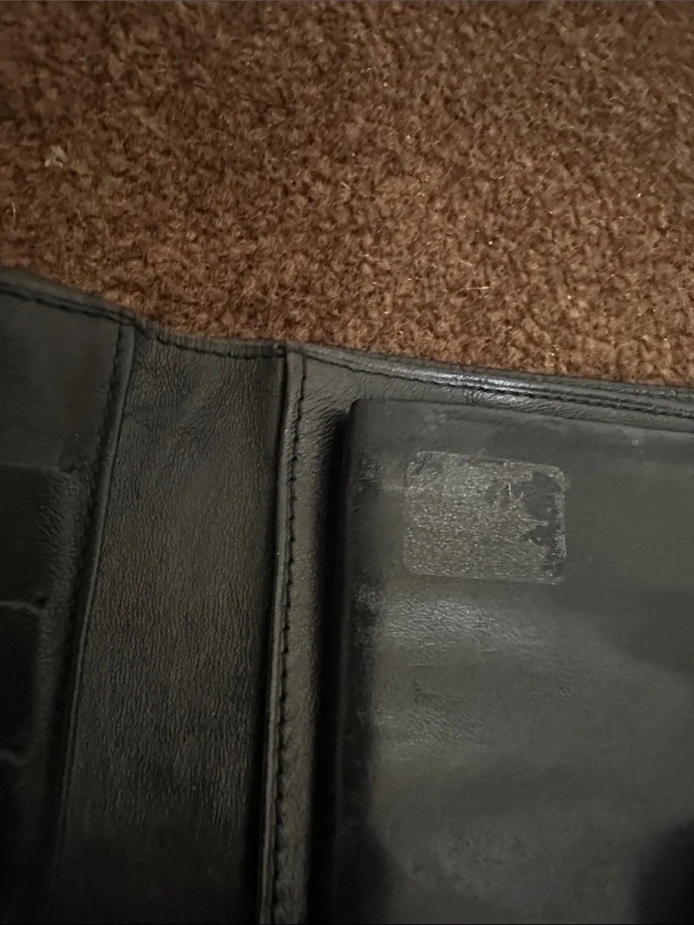 CHANEL Black Quilted CC Caviar Leather wallet.